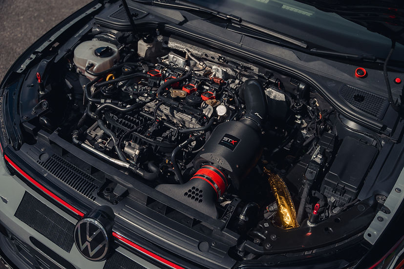 SprogTech STX EA8 enclosed motorsport intake kit for EA888 Gen 3 & 4 engines, shown installed on a vehicle.