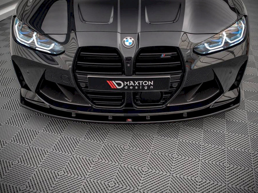 Maxton Design BMW M4 G82 front splitter V.1, body and styling accessory, made of durable material, installed on the car's front bumper.