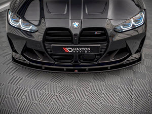 Maxton Design BMW M4 G82 front splitter V.1, body and styling accessory, made of durable material, installed on the car's front bumper.