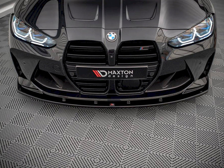 Maxton Design BMW M4 G82 front splitter V.1, body and styling accessory, made of durable material, installed on the car's front bumper.