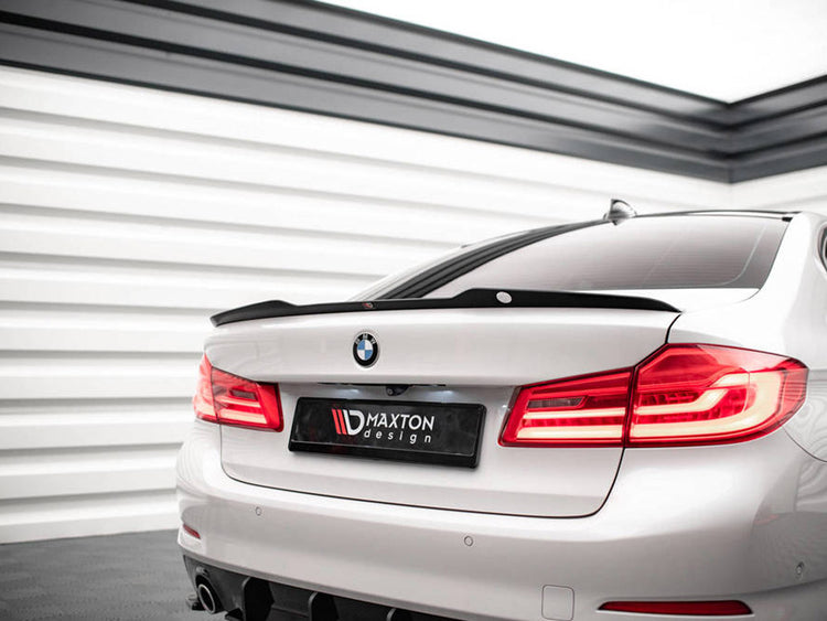 MAXTON® DESIGN spoiler CAP V.1 for BMW 5 Series G30 sedan, shown installed on the vehicle's rear trunk lid.