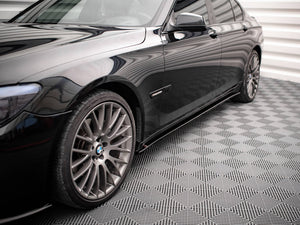 Maxton Design BMW 7 Series F01 M-Pack side skirts and diffusers in black, showing detailed aerodynamic styling and fitment.