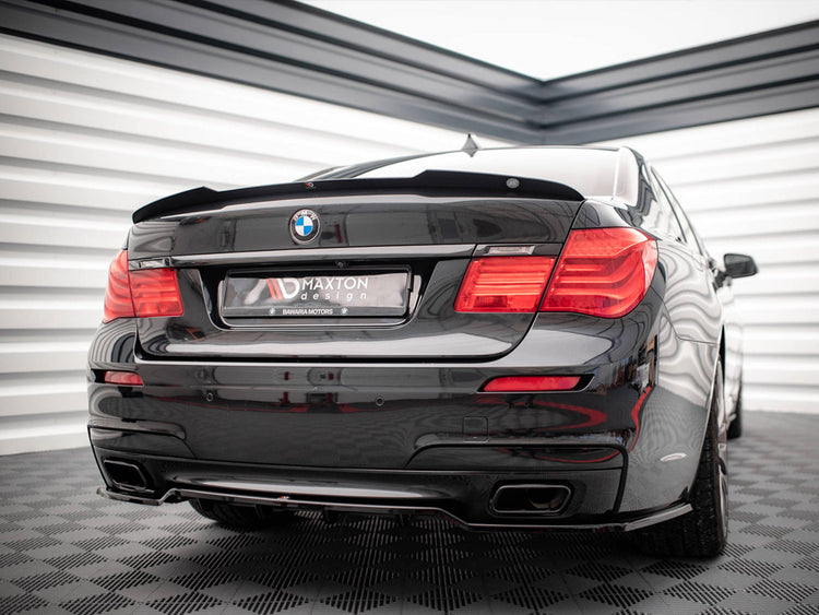 Maxton Design BMW 7 Series F01 M-Pack spoiler in black with aerodynamic wing and mounting hardware, designed for sporty enhancement