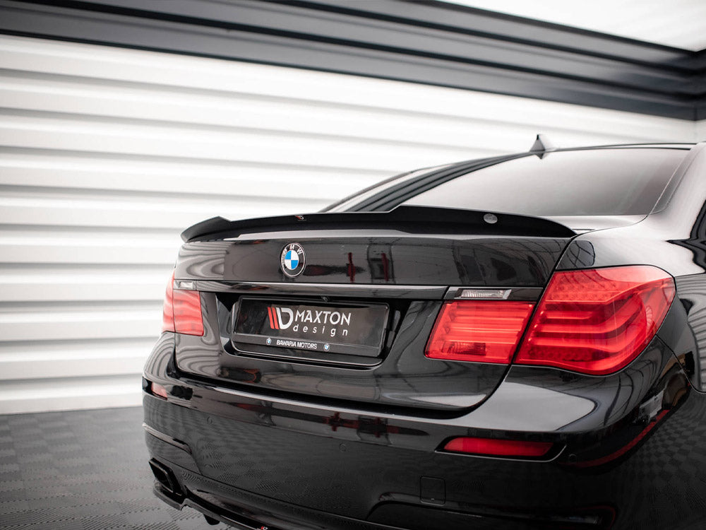 Maxton Design BMW 7 Series F01 M-Pack spoiler in black with aerodynamic fins, designed for enhanced sporty appearance.