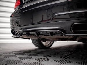 Maxton Design BMW 7 Series F01 rear splitter with vertical bars, showcasing durable construction and sleek design for M-Pack model.