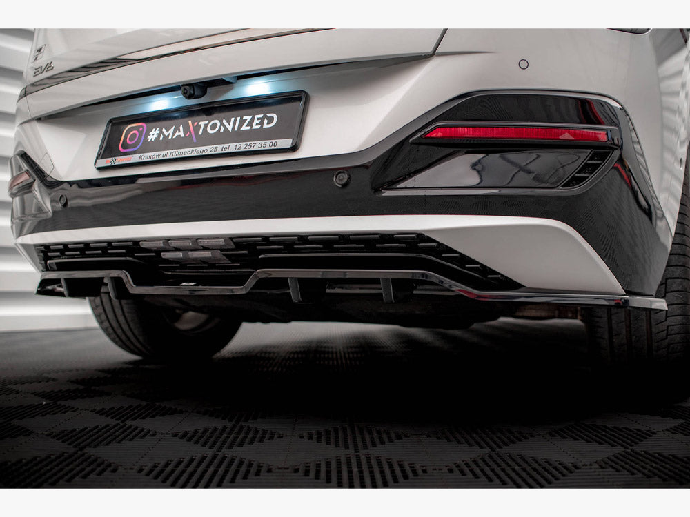Maxton Design rear splitter with vertical bars for Kia EV6 GT-Line Mk1, a body styling accessory mounted at the vehicle's rear.