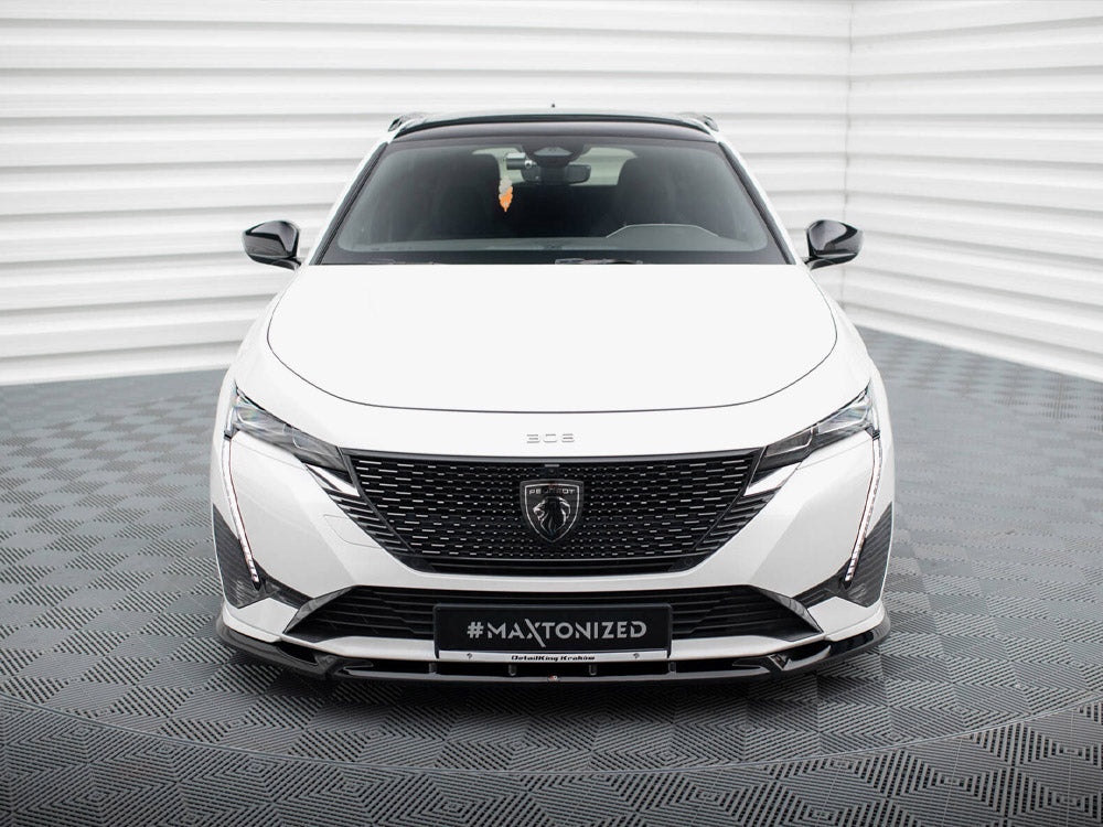 Maxton Design front splitter for Peugeot 308 GT Mk3, body and styling accessory, painted black, installed on the vehicle's front bumper.
