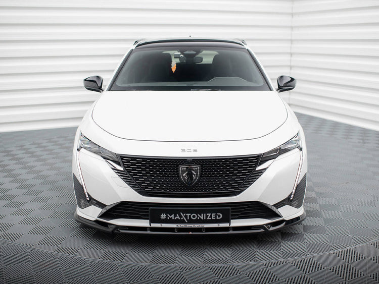Maxton Design front splitter for Peugeot 308 GT Mk3, body and styling accessory, painted black, installed on the vehicle's front bumper.