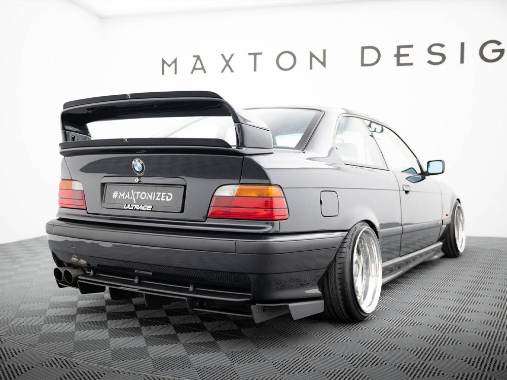Maxton Design rear diffuser for BMW M3 E36 coupe and convertible, showcasing sleek black aerodynamic design.