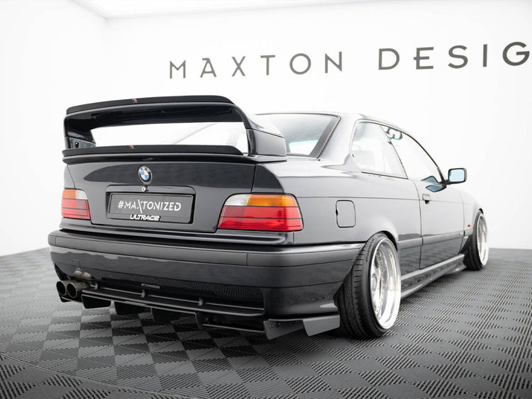 Maxton Design rear diffuser for BMW M3 E36 coupe and convertible, showcasing sleek black aerodynamic design.