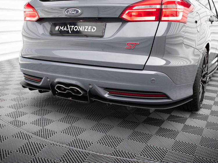 Maxton Design rear diffuser for Ford Focus 3 ST Estate, body styling accessory, black plastic with aerodynamic design.