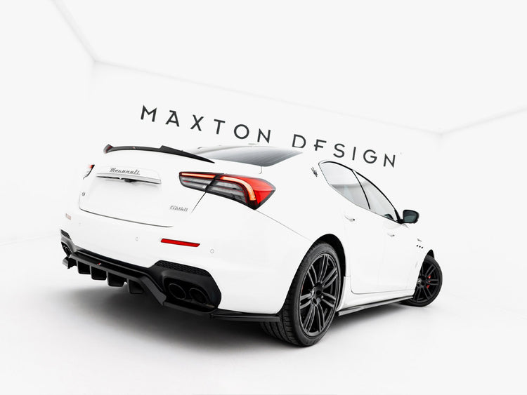 MASTON® DESIGN spoiler cap for Maserati Ghibli Mk3, showing sleek aerodynamic design in black with mounting details