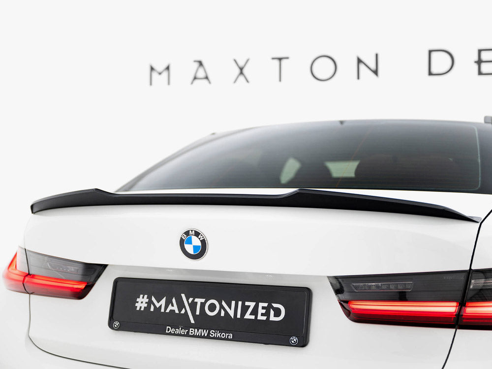 MAXTON® DESIGN spoiler cap for BMW 3 Series G20 (2018-2022), showing the sleek black spoiler cap on the car's rear.
