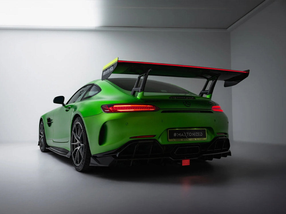 Carbon spoiler with integrated LED lights for Mercedes-AMG GTR C190 facelift, styled for enhanced aerodynamics and sporty appearance.