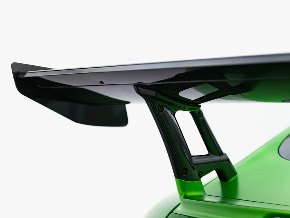 Carbon spoiler with integrated LED lights for Mercedes-AMG GTR C190 facelift, styled for enhanced aerodynamics and sporty appearance.