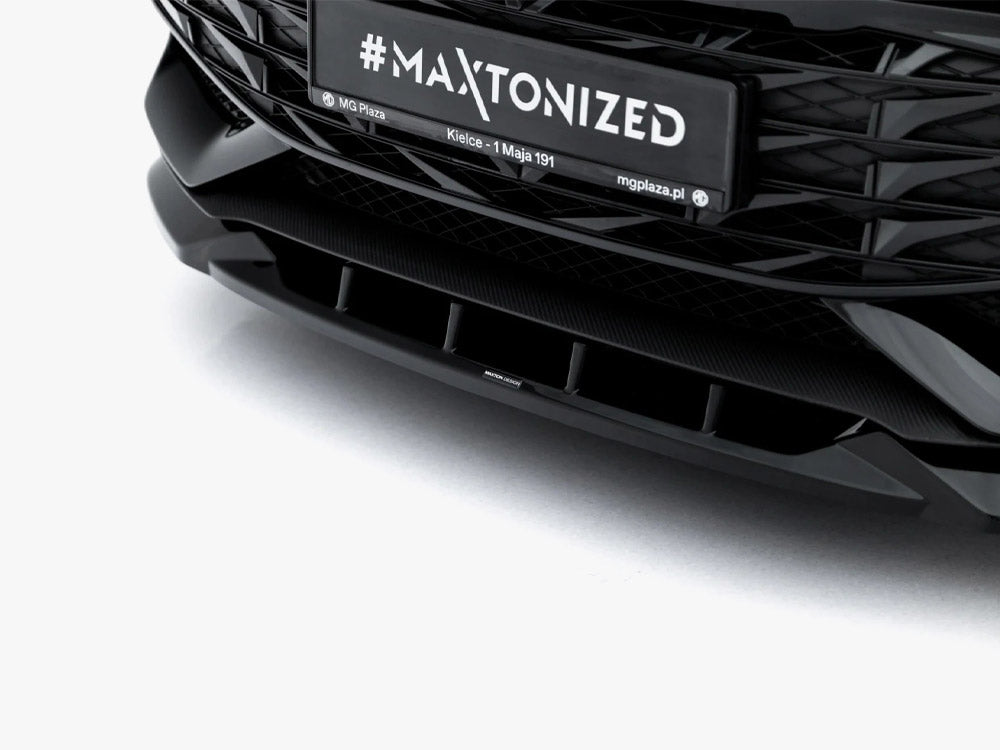 Maxton Design Front Splitter V.1 for MG 3 Mk1, a black aerodynamic body styling part with mounting details, designed for improved downforce.