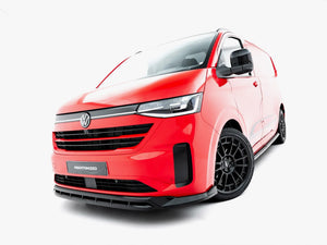 Maxton Design Front Splitter V.2 for Volkswagen Transporter T7, black aerodynamic car accessory, mounted on front bumper.