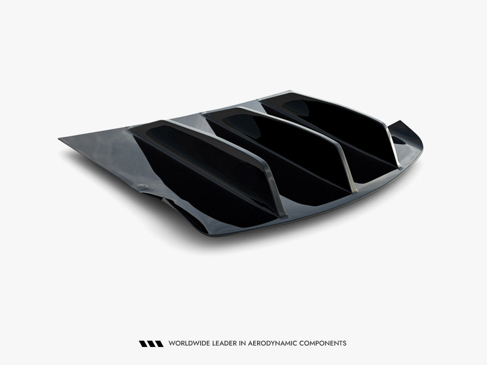 Maxton Design rear valance for Tesla Model S Mk1, black plastic exterior with aerodynamic styling and mounting brackets visible.