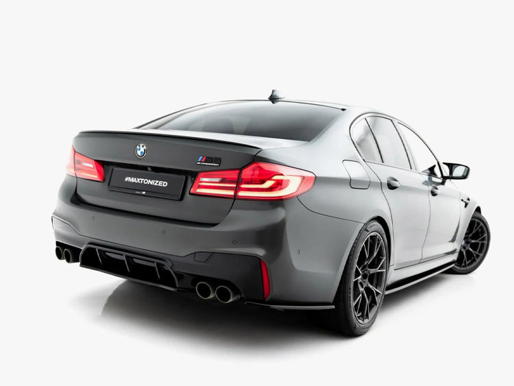 Maxton Design BMW M5 F90 rear splitter in black, made for body and styling enhancement, mounted on the car's rear bumper.