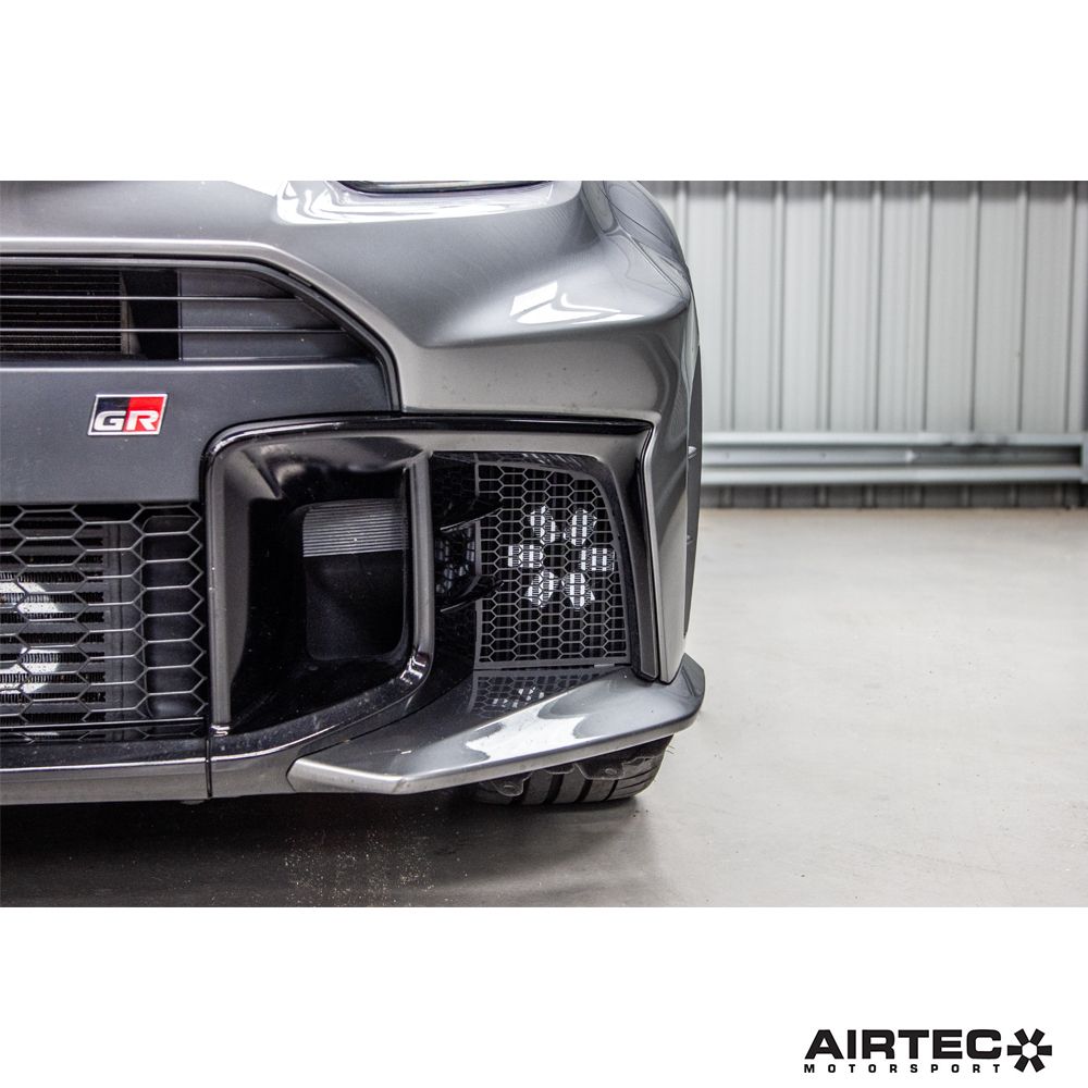 AIRTEC Motorsport gearbox oil cooler installed in a Toyota Yaris GR Gen 2, showcasing the compact aluminum cooling unit.