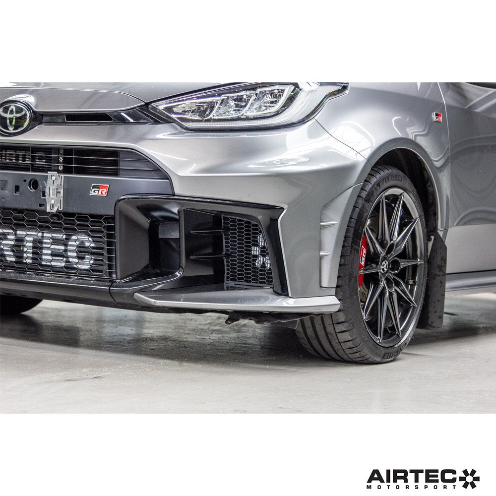 AIRTEC Motorsport gearbox oil cooler installed in a Toyota Yaris GR Gen 2, showing the compact cooling unit and mounting setup.