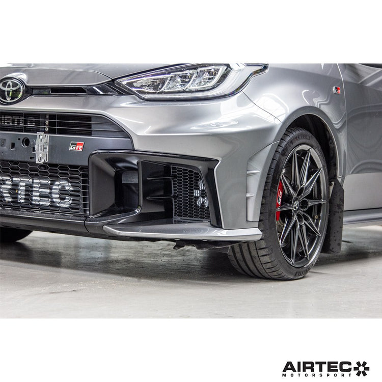 AIRTEC Motorsport gearbox oil cooler installed in a Toyota Yaris GR Gen 2, showing the compact cooling unit and mounting setup.