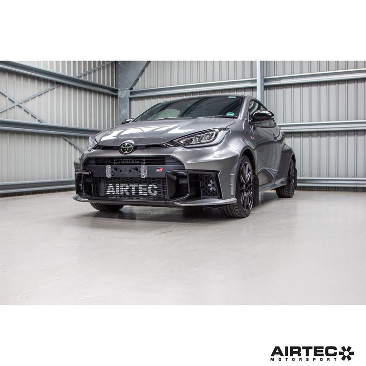 AIRTEC Motorsport Gearbox Oil Cooler installed in a Toyota Yaris GR Gen 2 automatic transmission, showing the cooler and fittings.
