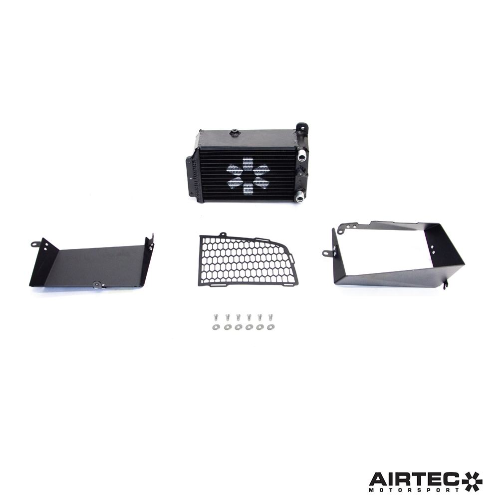 AIRTEC Motorsport auxiliary radiator for Toyota Yaris GR Gen2, showing the black metal radiator with mounting brackets.