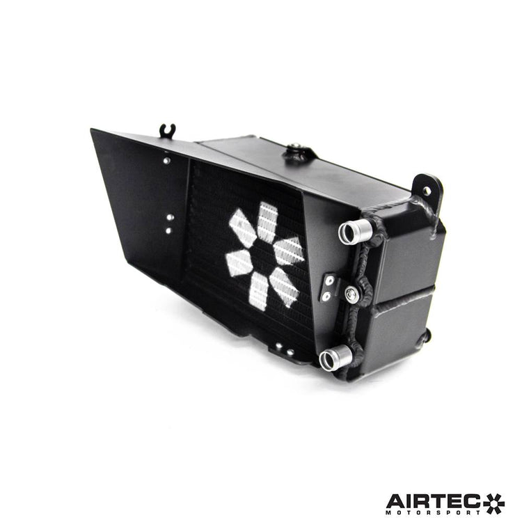 AIRTEC Motorsport auxiliary radiator for Toyota Yaris GR Gen2, shows sleek black cooling fins and mounting hardware.