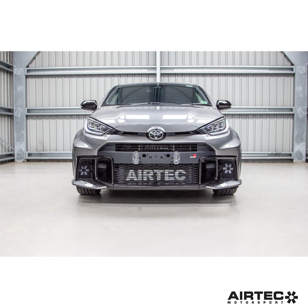 AIRTEC Motorsport auxiliary radiator installed in a Toyota Yaris GR Gen2, showing the compact, high-performance cooling component.