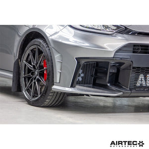 AIRTEC Motorsport auxiliary radiator installed in a Toyota Yaris GR Gen2, showing the compact cooling component and mounting details.