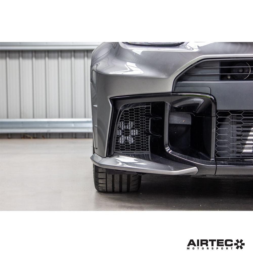 AIRTEC Motorsport auxiliary radiator installed in a Toyota Yaris GR Gen2 for enhanced cooling performance.