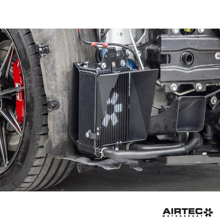 AIRTEC Motorsport auxiliary radiator installed in a Toyota Yaris GR Gen2, showing the compact, high-performance cooling component.