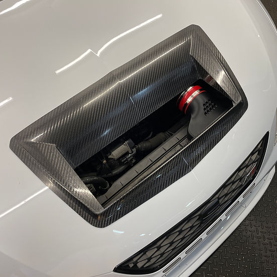 SprogTech STX EA8 enclosed intake kit for EA888 Gen 3 & 4 engines, shown installed on a vehicle's engine bay.