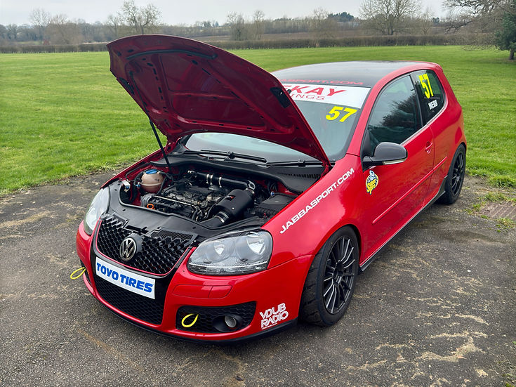 SprogTech STX EA3 Enclosed Intake Kit for 2.0 TFSI engine, black body with sleek design, installed in a car engine bay