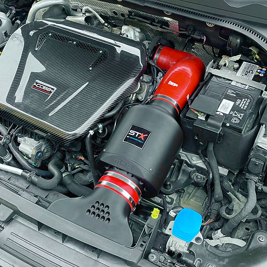 SprogTech STX EA8 Enclosed Motorsport Intake Kit for EA888 Gen 3 & 4 engines, shown installed on a vehicle with sleek body styling.