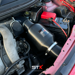 SprogTech STX K4M enclosed intake kit for Twingo RS by Sprogley Motorsport, shown installed on the vehicle.
