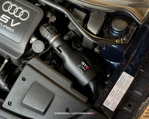 SprogTech STX BAM enclosed intake kit for VAG 1.8T engine, shown installed on a vehicle with body and styling components