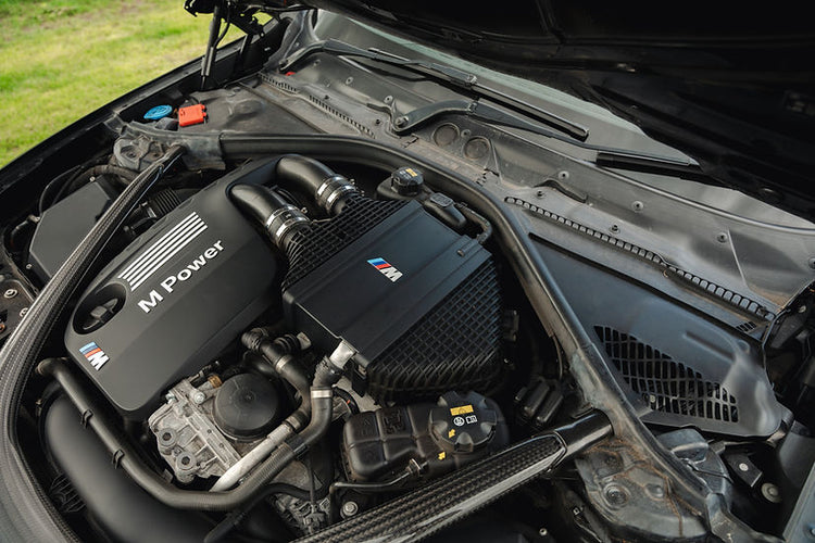 Sprogley Motorsport S55 Charge Cooler Cover in body and styling, showcasing the sleek black design with branding details.