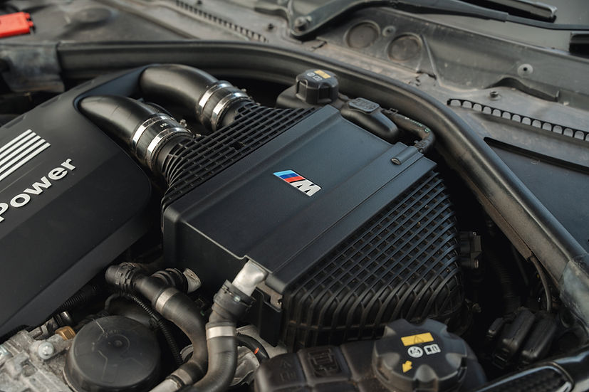 Sprogley Motorsport S55 Charge Cooler Cover in black with branding, designed for improved engine cooling and stylish body enhancement.