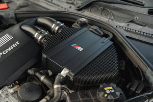 Sprogley Motorsport S55 Charge Cooler Cover in black with branding, designed for improved engine cooling and stylish body enhancement.
