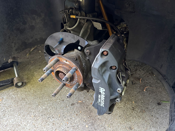 Sprogley Motorsport brake cooling kit for MQB and MQB EVO lower control arms, featuring cooling ducts and hardware for enhanced brake performance.