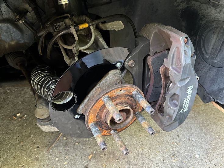 Sprogley Motorsport brake cooling kit for MQB and MQB EVO lower control arms, with cooling ducts and mounting hardware visible.