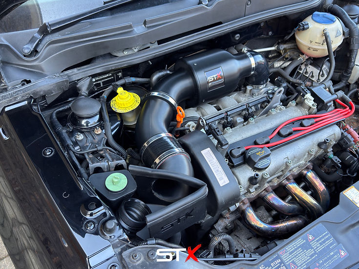 SprogTech STX AVY V2 enclosed intake kit for VW Lupo 1.4, 1.4S, 1.6 GTI, shown installed with black body components