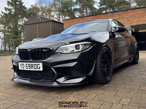 Sprogley Motorsport front bumper canards for F87 BMW M2, aerodynamic body styling accessories attached to the front bumper.