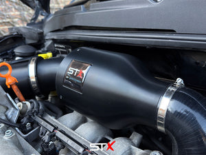 SprogTech STX AVY V2 enclosed intake kit for VW Lupo 1.4, 1.4S, 1.6 GTI, showing the black intake enclosure and hoses