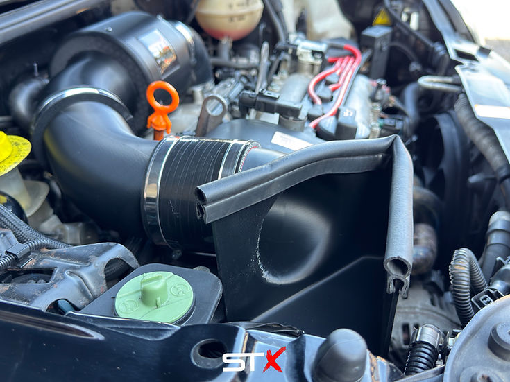 SprogTech STX AVY V2 enclosed intake kit for VW Lupo 1.4, 1.4S, 1.6 GTI, showcasing the sleek air intake component