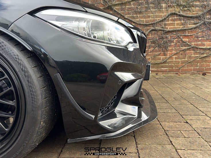 Sprogley Motorsport front bumper canards on a BMW M2 F87, enhancing aerodynamic styling and aggressive front-end look.