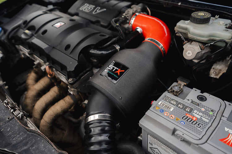 SprogTech STX TU5 enclosed intake kit installed on Peugeot 106 or Citroen Saxo, showcasing the body and styling enhancement by Sprogley Motorsport.