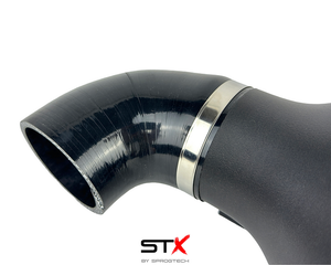 SprogTech STX K4M enclosed intake kit for Twingo RS by Sprogley Motorsport, featuring sleek black body and air intake components.